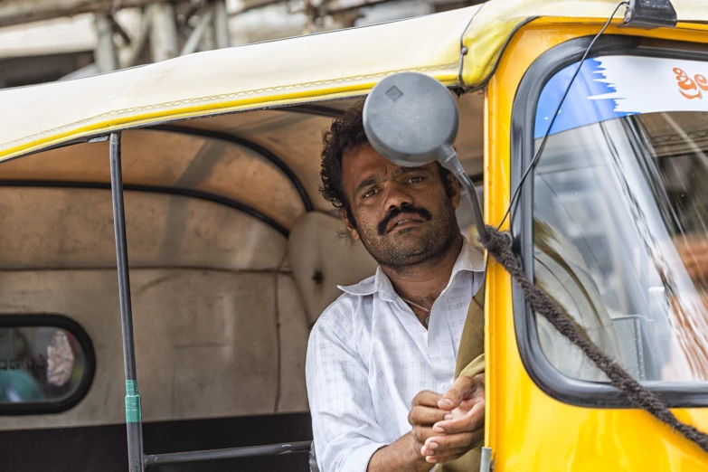 a person riding in a vehicle with soing on its head