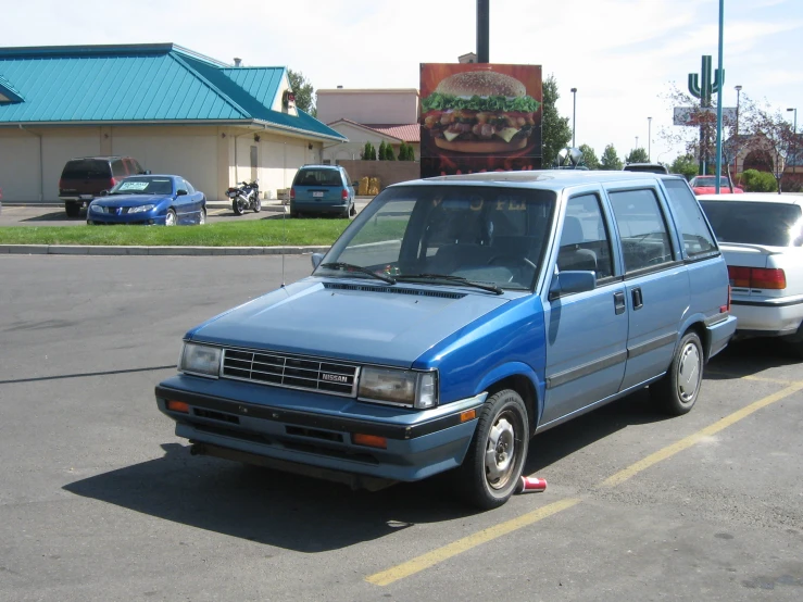 two cars parked on a parking lot next to each other