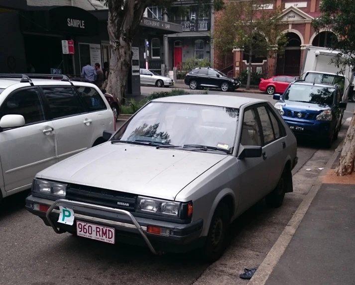 an old car parked near an older car