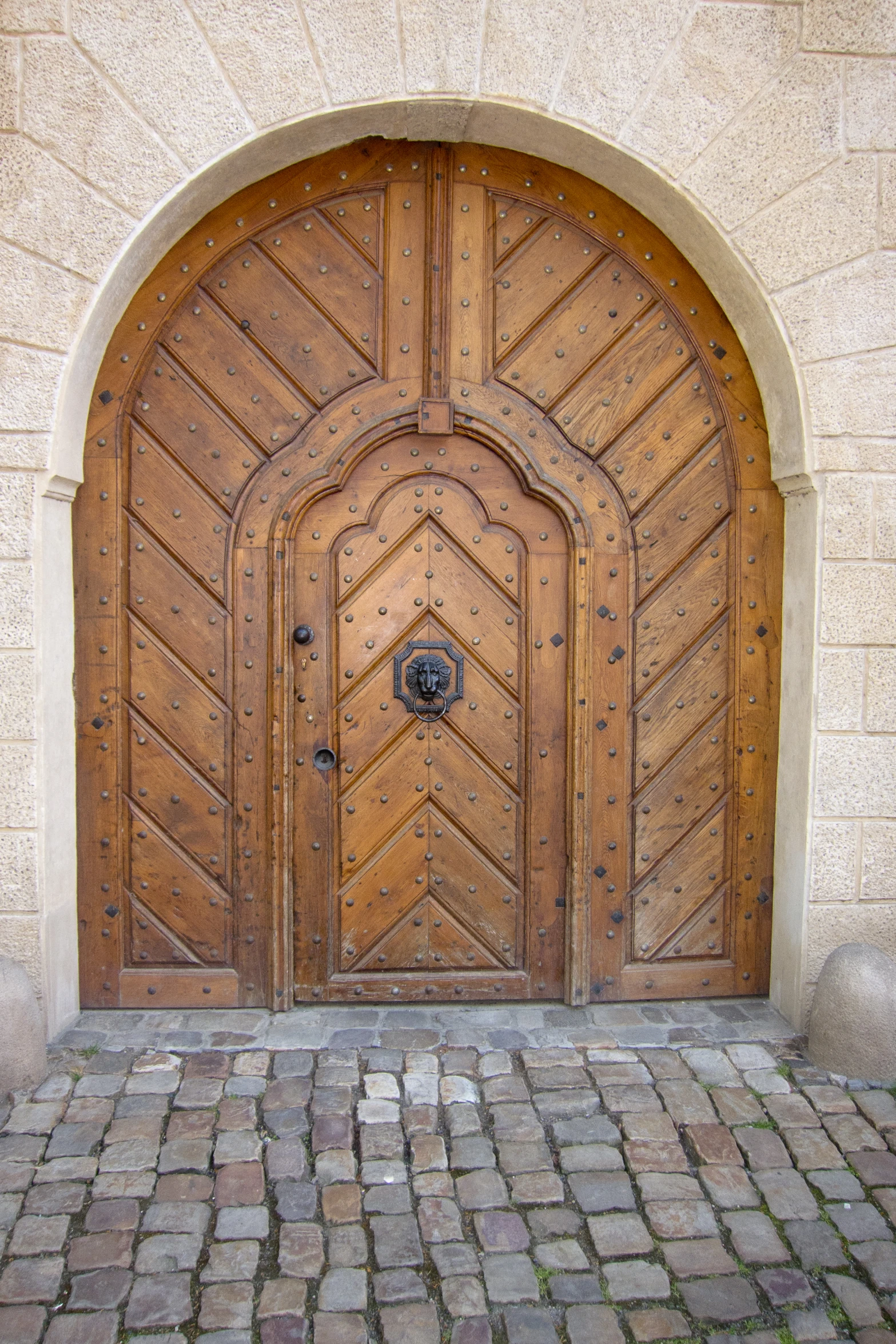 a brown door that has a brick patio in it