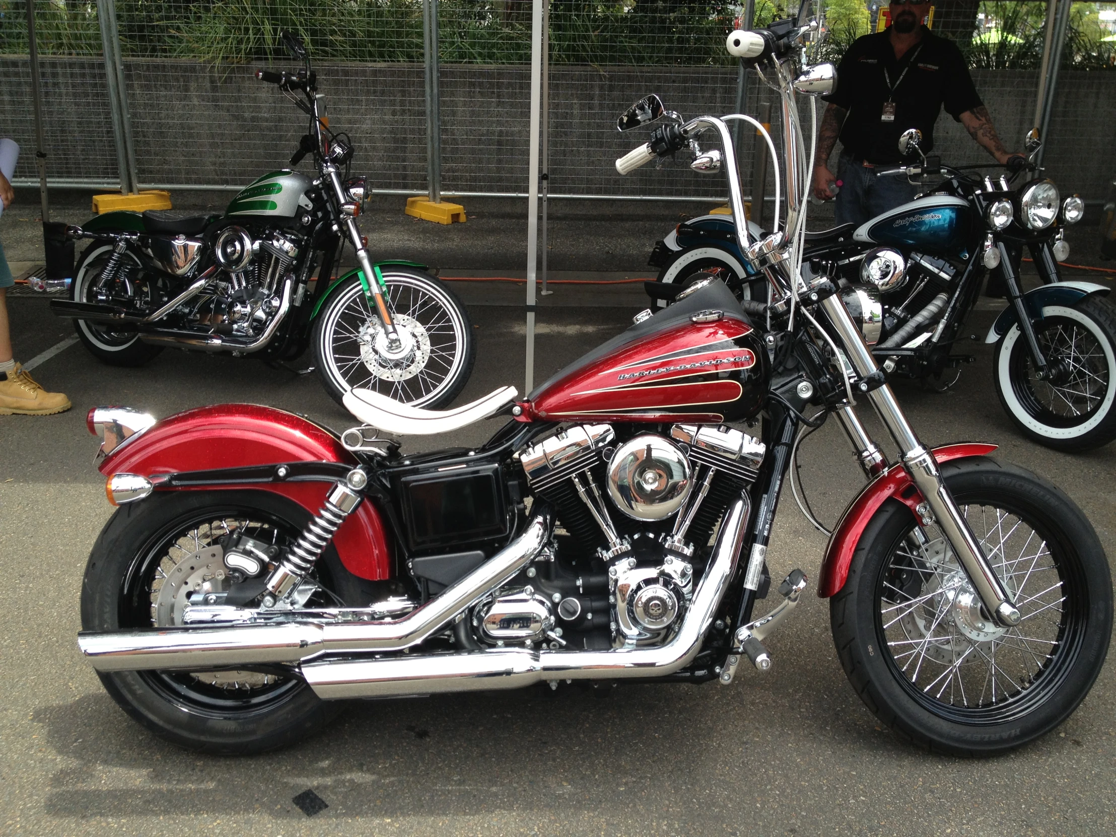 two motorcycles are parked beside each other in a parking lot