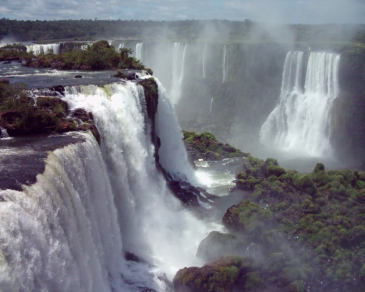 a very tall waterfall that has a bunch of water