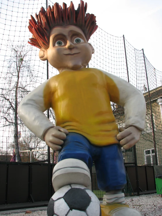 a large plastic statue of a  in his underwear and soccer shoe