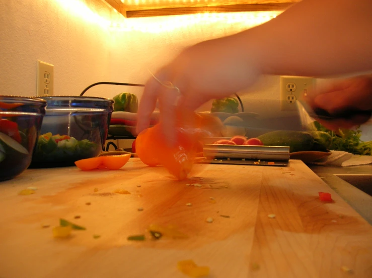 the chef is slicing up vegetables on the board