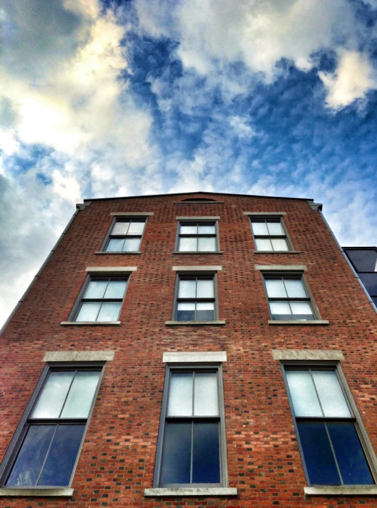 a tall building with many windows on the side