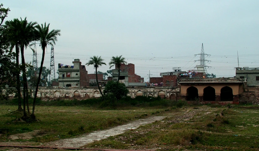 a village in an area with buildings and palm trees