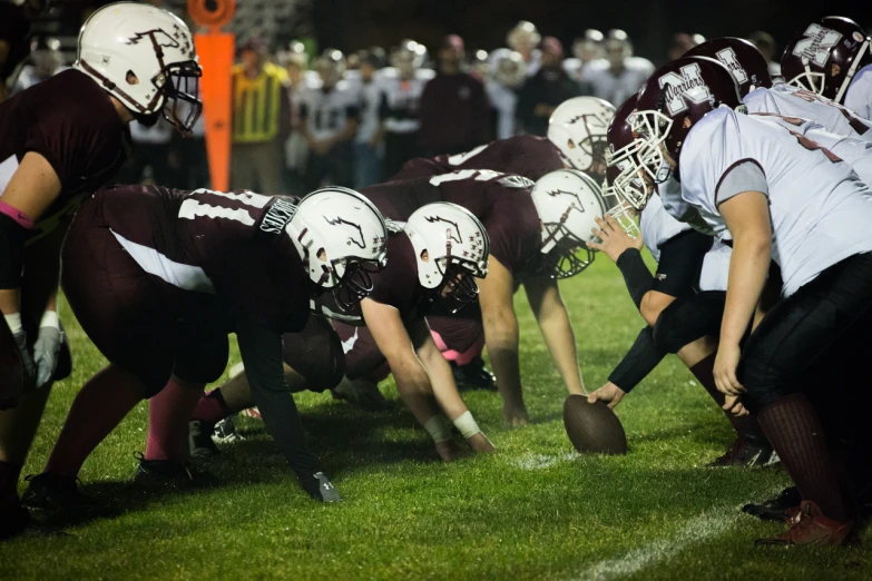 several football players playing with the ball