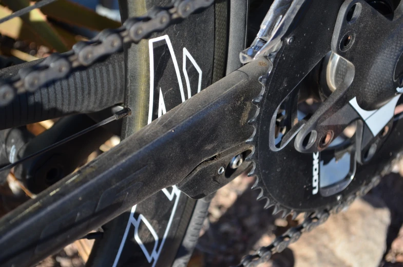 a close up of a bicycle's chain and gears