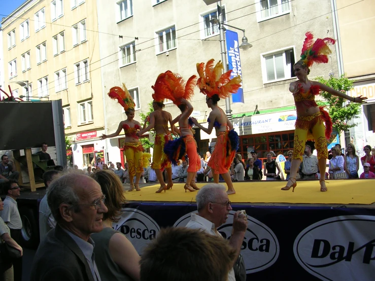 the performers are in the parade on stage