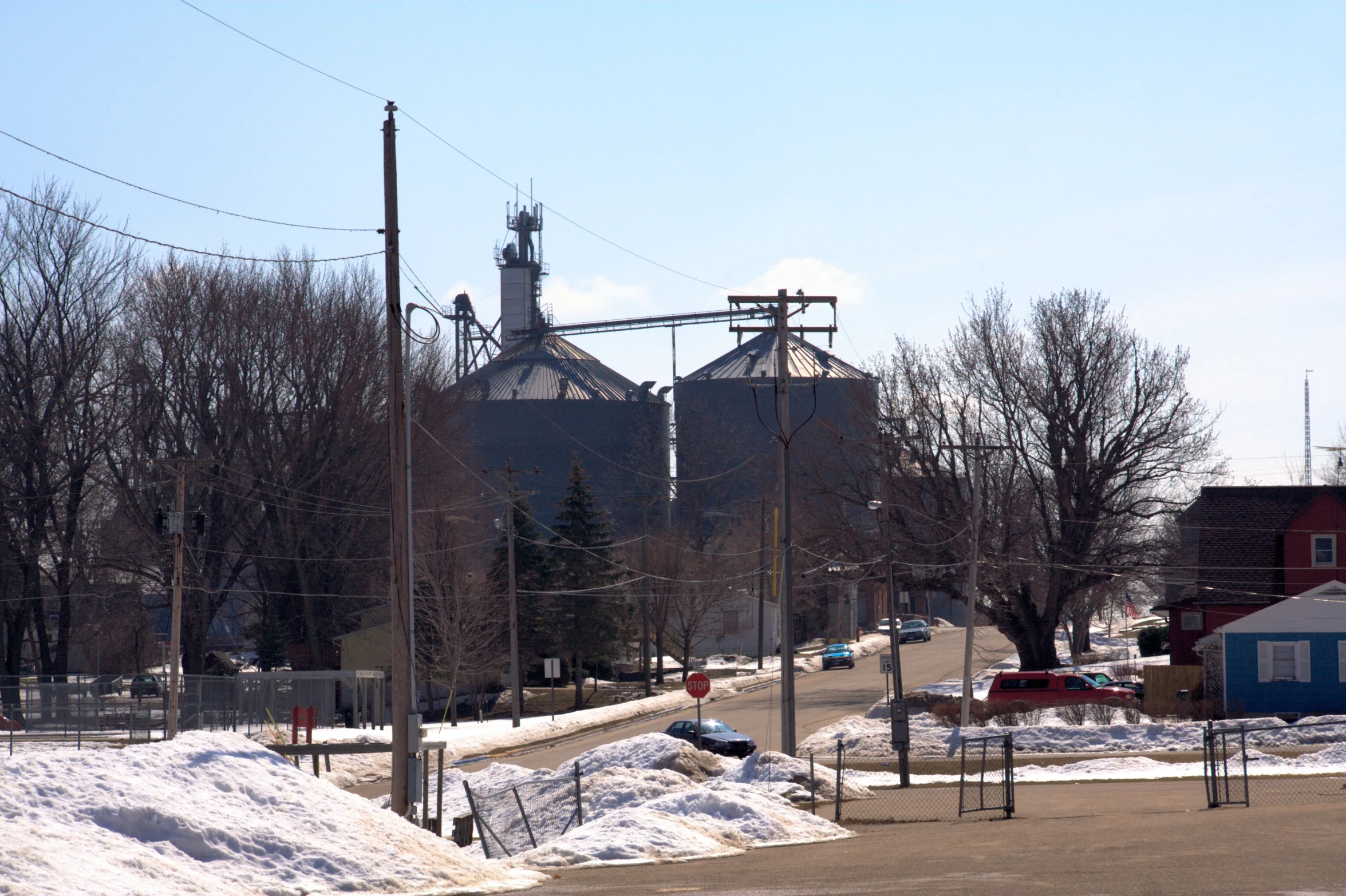 an old, large factory is standing on a snowy street