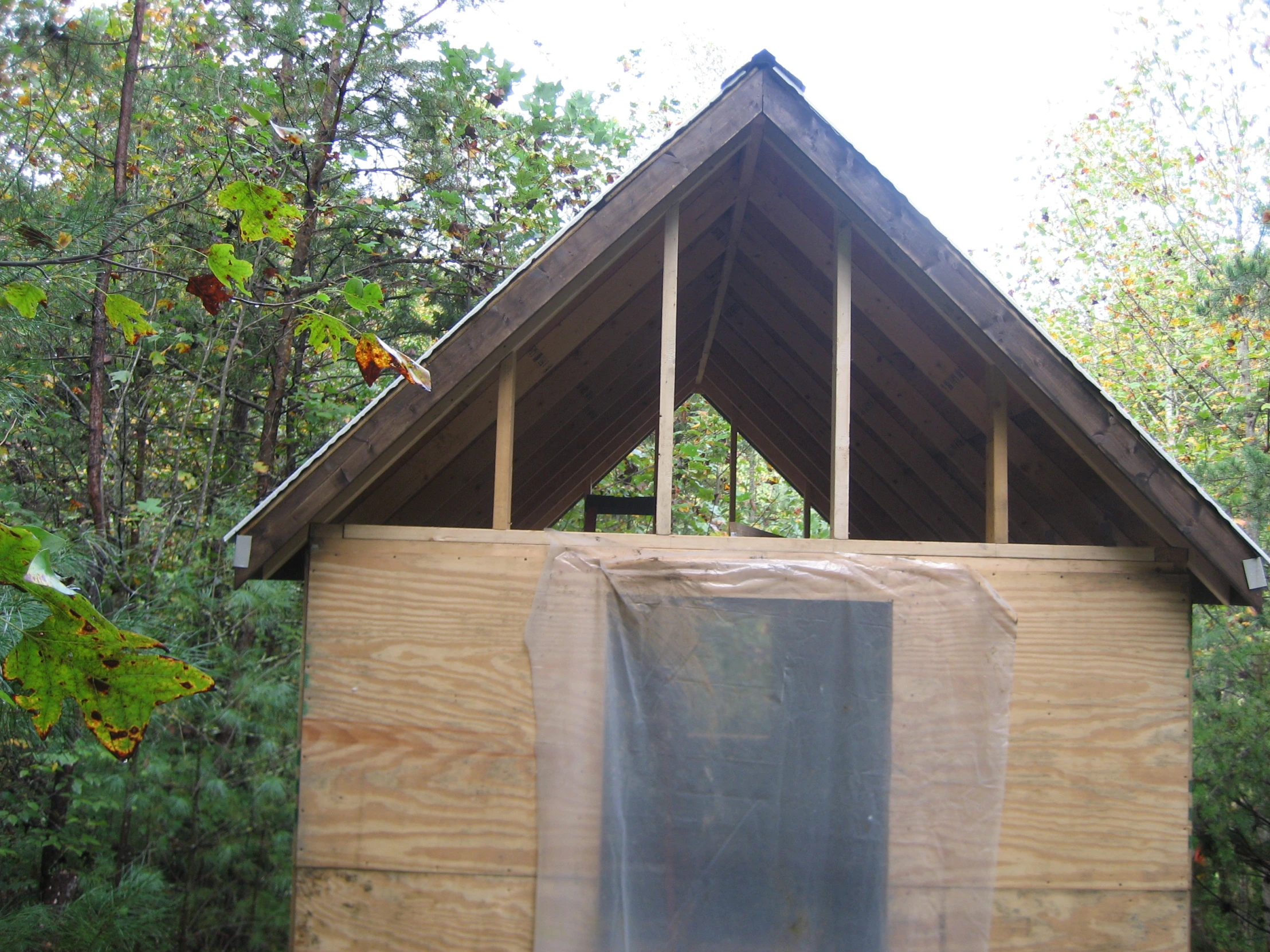 a barn that has wood cut in half with the roof ripped off