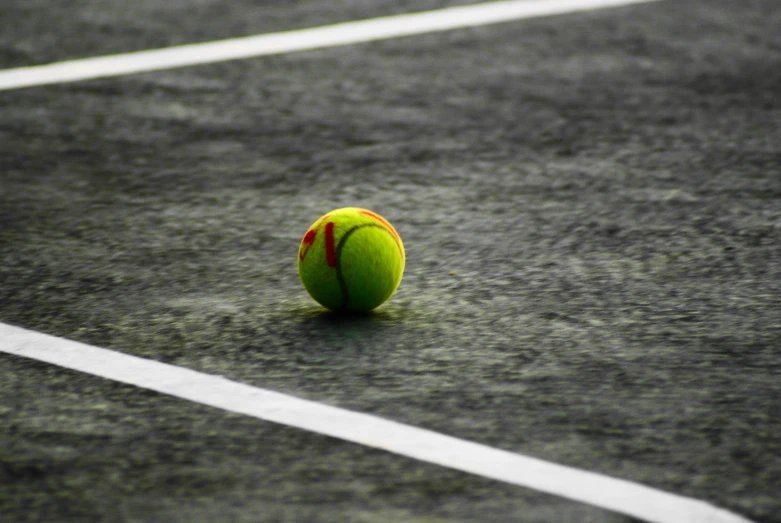 tennis ball on the court with white lines