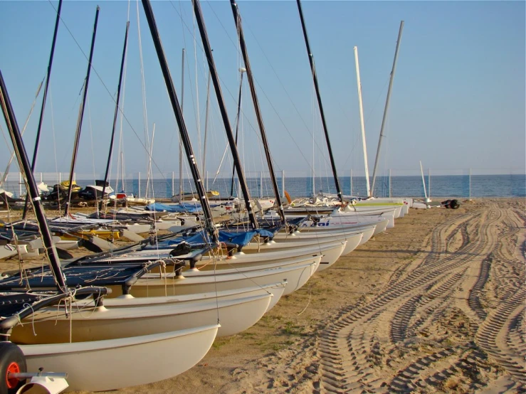 a bunch of boats lined up on the beach