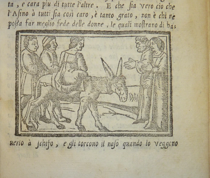 an old book with a drawing of two men on horses