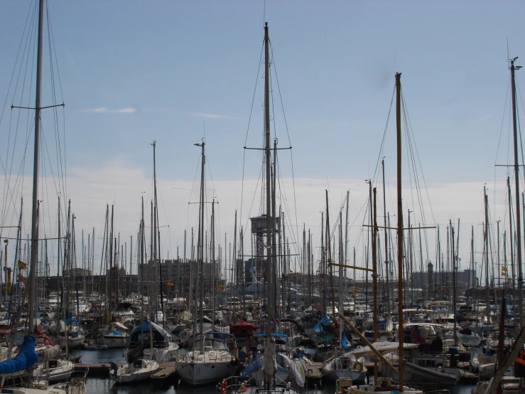 a fleet of boats and yachts moored at the dock