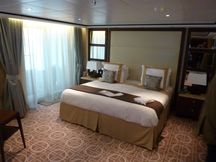 bedroom on a cruise ship with a large bed