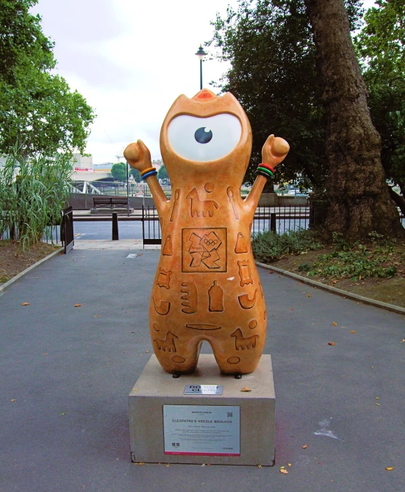 a statue of a person on top of a park