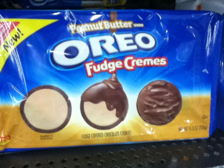 three bags of oreo fudge cremes on a shelf