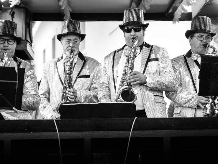 a band with hats standing next to each other