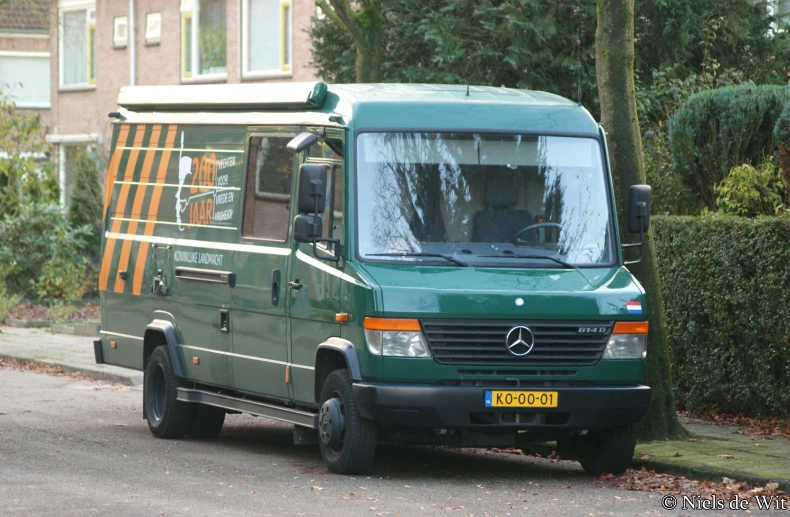 the truck is on the road near a tree