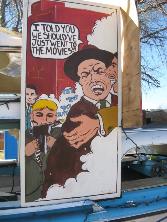 a mural of two cartoony men pointing to a billboard