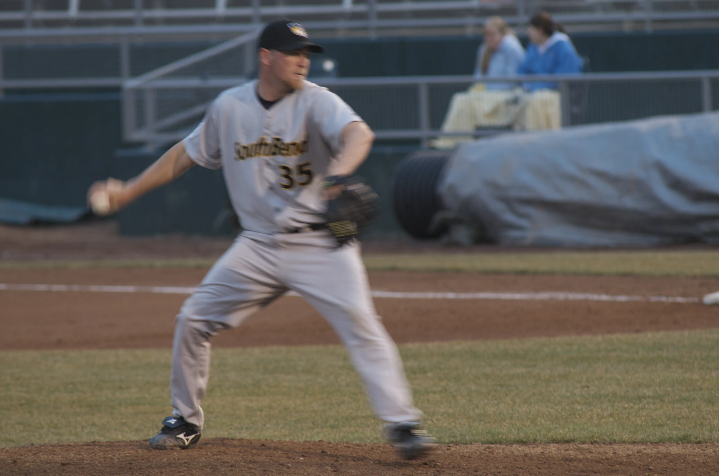 there is a male baseball player standing in the field