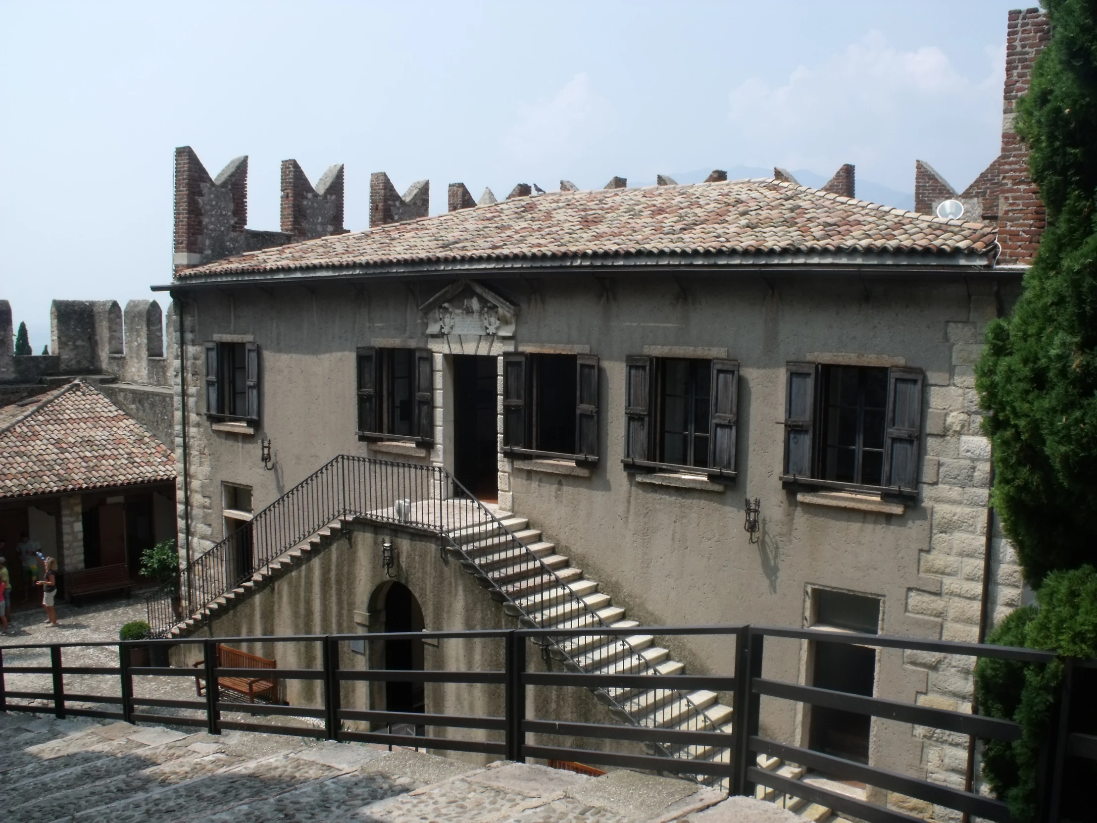 an old building with a stair case in front