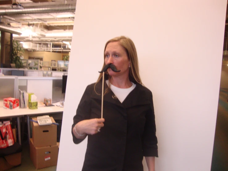 a woman with a mustache attached to her nose