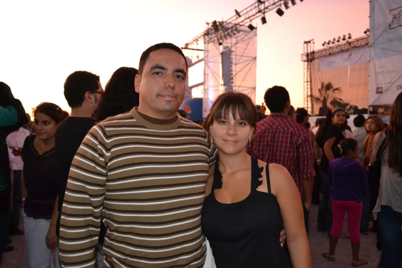 a couple is standing together at an event