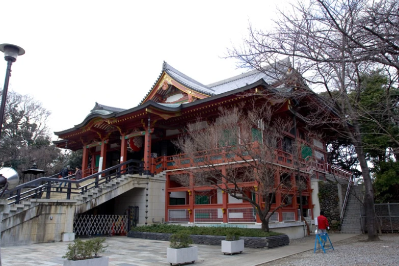 asian building in the city with two men standing outside it