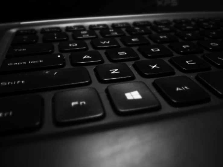 closeup s of black laptop keyboard and windows