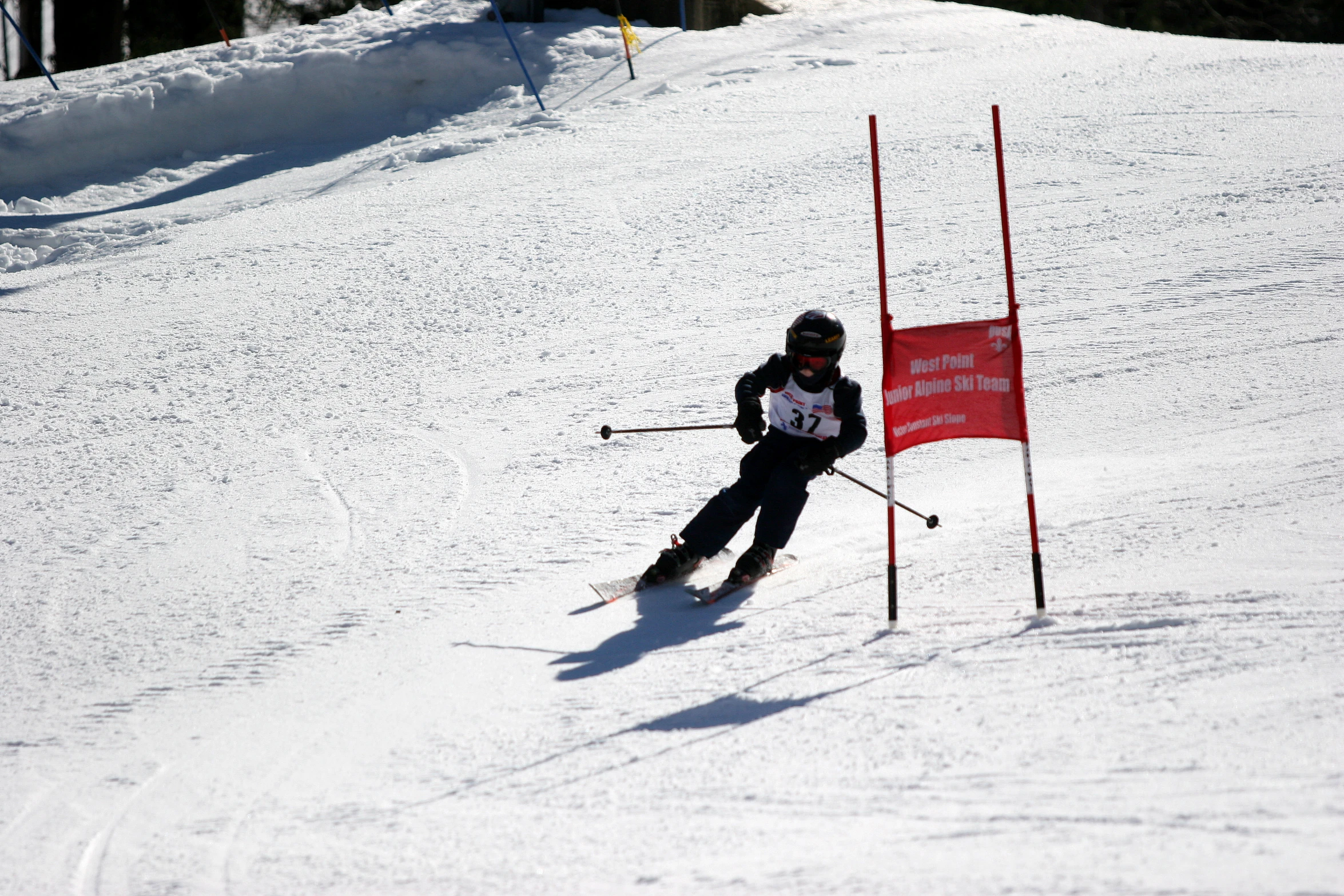 a person in skiing attire coming down the hill