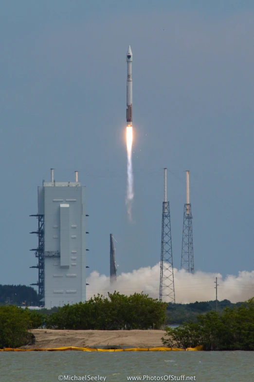 a rocket is taking off in the blue sky