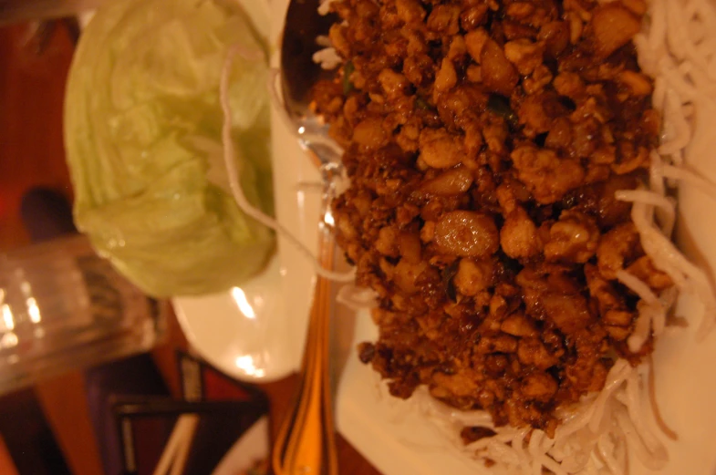 two plates of chinese food sit on a table