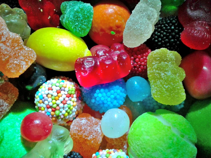gummy bears and fruits that are multi - colored