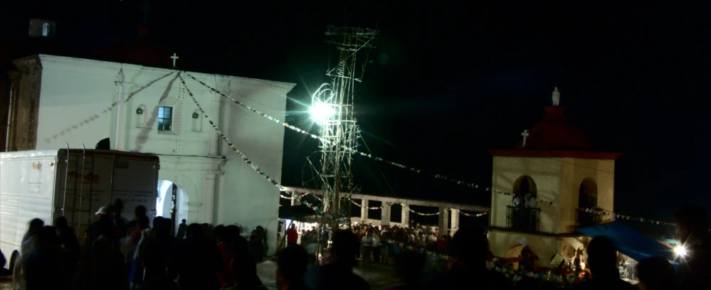 a view of a church from across the street with the lights on