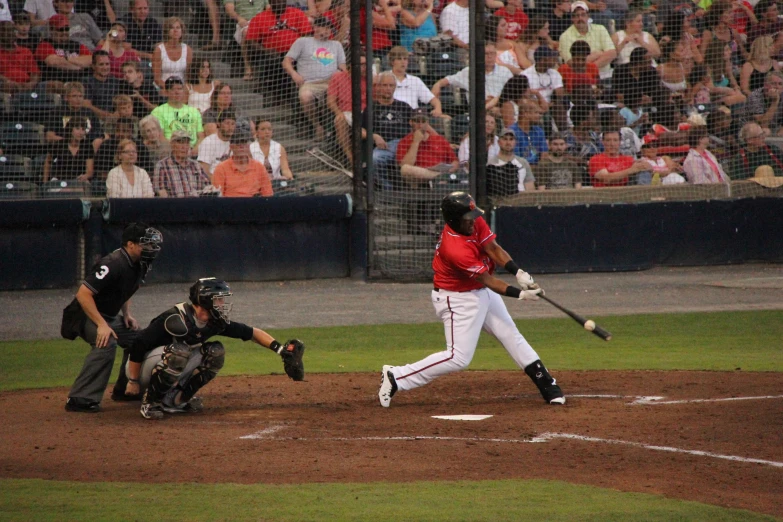 a batter swinging at a pitch during a baseball game