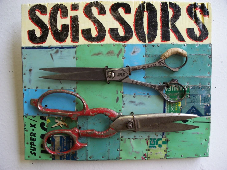 a pograph of scissors on wood with a tag