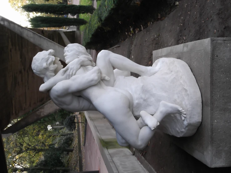 a statue of a person being hed into another