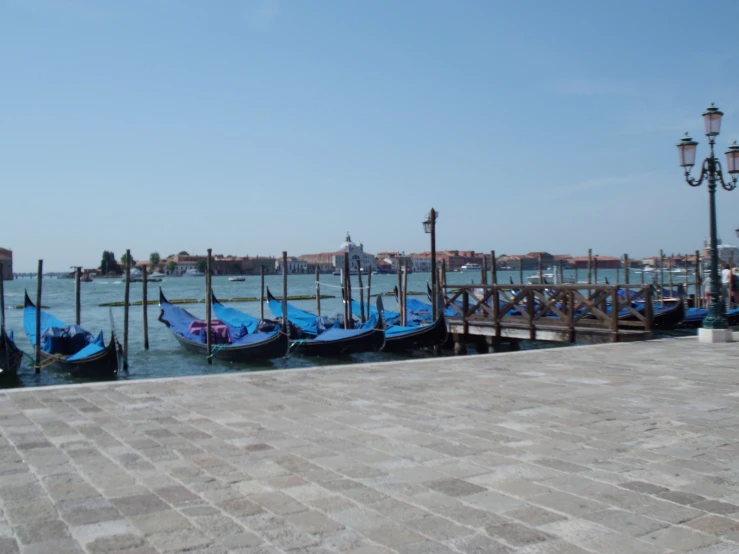 the buildings in the water are connected by wooden beams