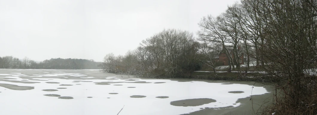 a big field that has some snow on it