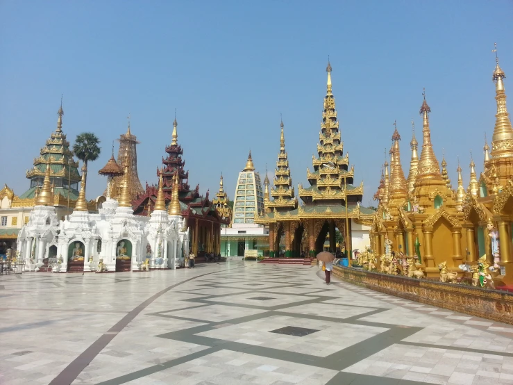 a group of buildings with golden domes