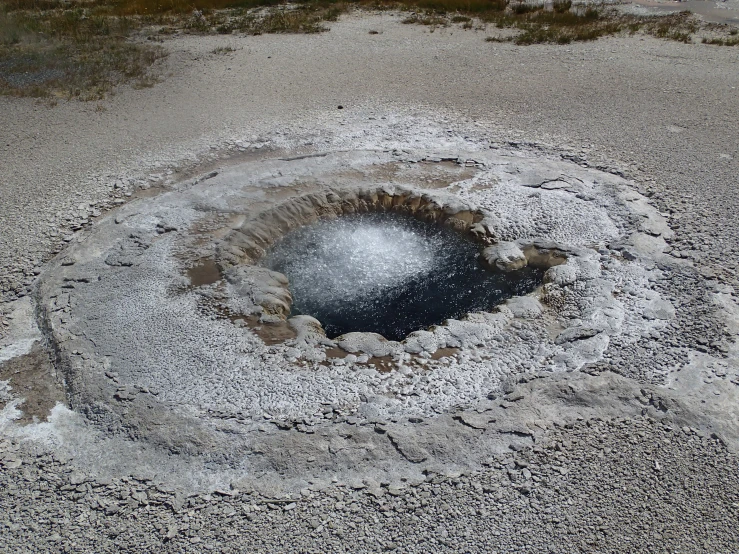 an open, large crater in a barren area