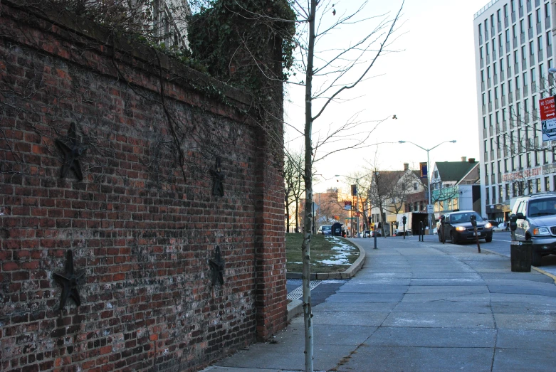 an old brick building on a narrow city street