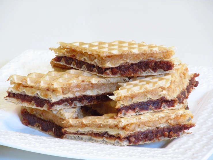 a plate holding five pieces of waffle - topped cake