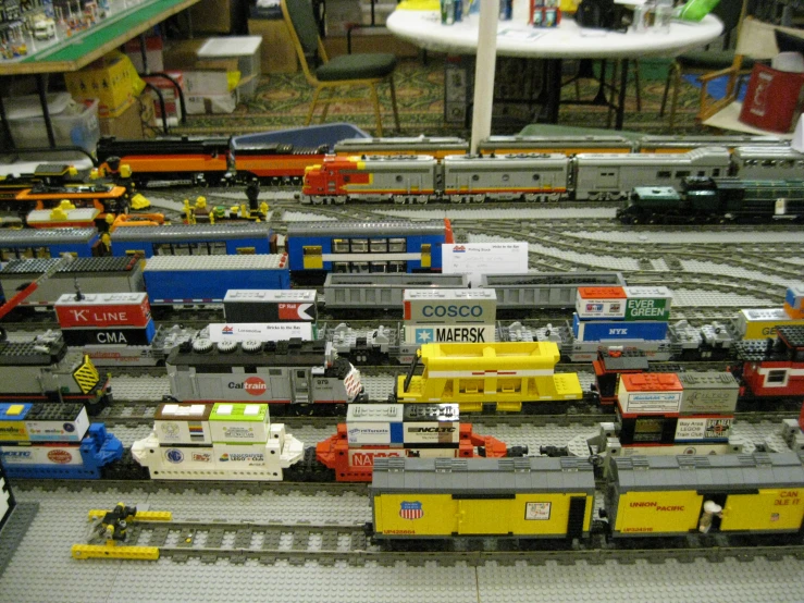 a train depot filled with different sized toy trains