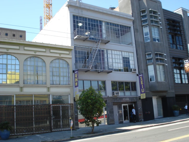 two buildings with windows that are not closed