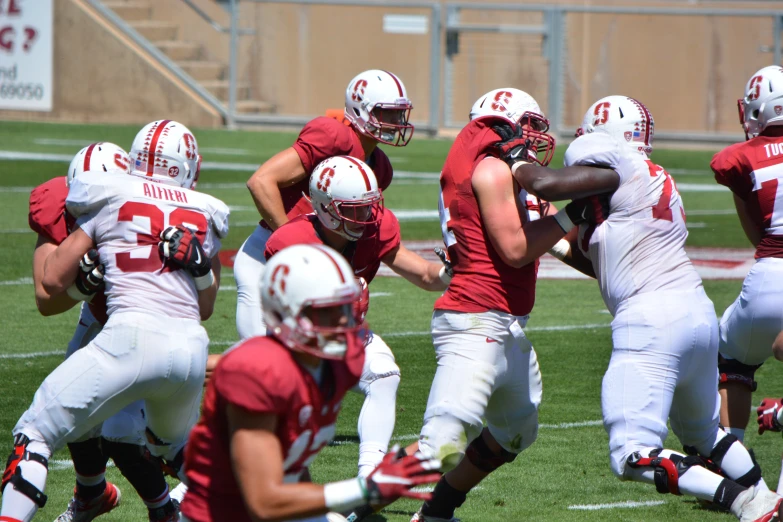 a group of men running a football game