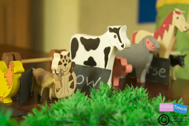 colorful wooden horses on top of some sort of desk