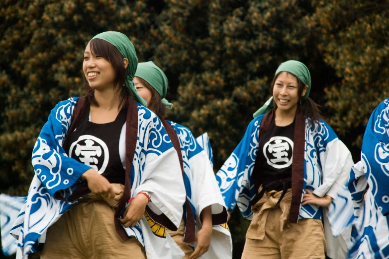 three asian girl dancers, dressed in traditional clothing